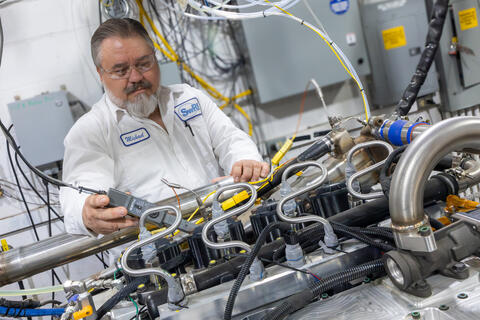 Researcher working on the spark-ignited hydrogen (H2) internal combustion engine designed for medium-duty commercial vehicles