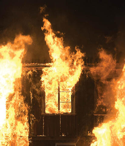 Fire coming out of house window