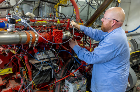 Technician working on H2-ICE in a test cell
