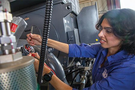 woman working at heat combustion facility