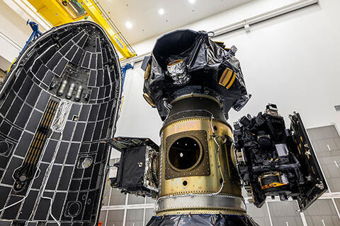 The trio of spacecraft designed to monitor and map the heliosphere and the solar wind that defines it are shown here prior to integration in the rocket fairing at left.