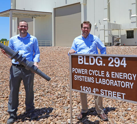 SwRI Engineers Dr. Aaron McClung and Dr. Tim Allison standing outside of the STEP pilot plant