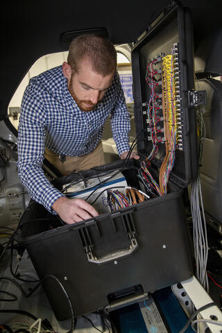SwRI engineer working on battery performance instrumentation