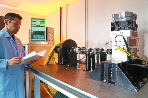 Carlos Sanchez standing in front of a test lab