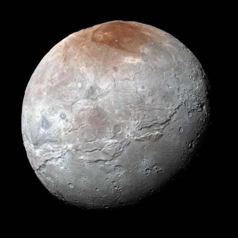NASA’s New Horizons captured this high-resolution enhanced color view of Charon just before closest approach on July 14, 2015