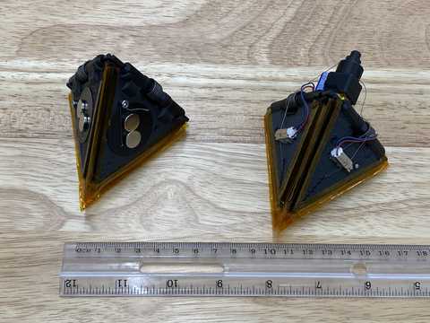 Two triangular-shaped devices on a table