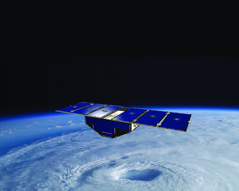 Blue satellite with solar panels orbiting the Earth