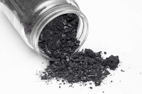 A jar of biochar, a charcoal-like substance made by heating organic materials.
