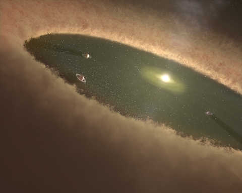 This artist’s concept of a young star system shows gas giants forming first