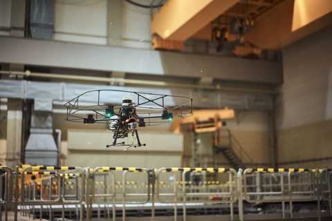 drone with autonomy software hovering over inoperable nuclear facility