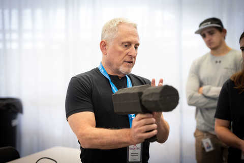 Alan Stern demonstrating a mockup of the camera used in the Southwest Ultraviolet Imaging System