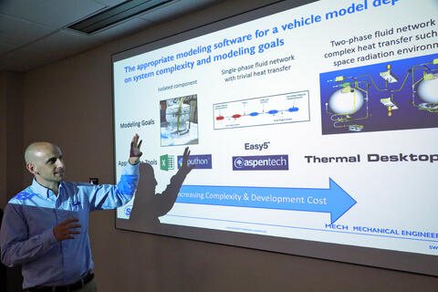 Grant Musgrove presenting in front a screen 