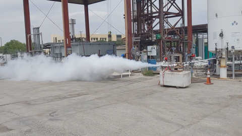 Cloud of white liquid nitrogen being released from a valve