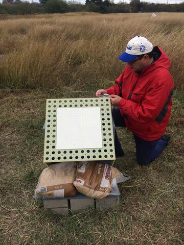 Dr. Marius Necsoiu sets up a Van Atta retroreflector panel