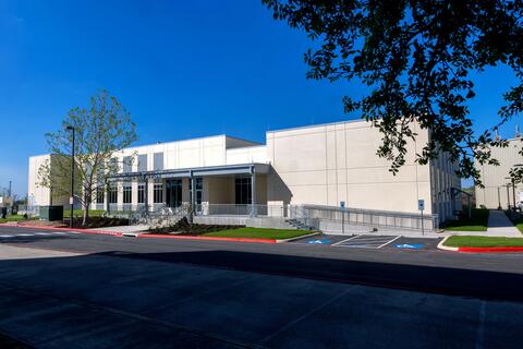 Exterior shot of SwRI's Clinical Supply Facility on a clear, bright day