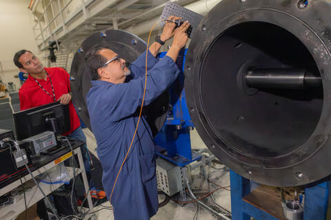 SwRI’s Dr. Pablo Bueno and Ben Uresti using the Institute’s large two-stage light-gas gun to create hypervelocity impacts 