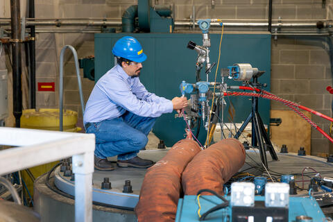 Engineer working on safety valve in a facility