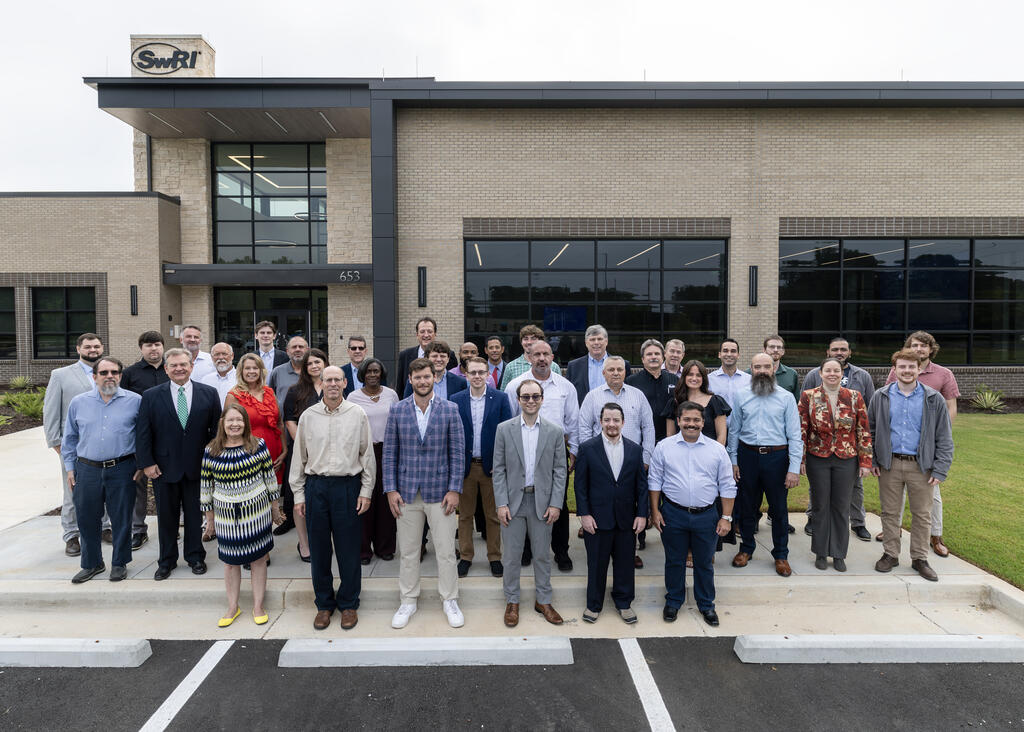 SwRI’s Warner Robins staff members gather in front of the new building