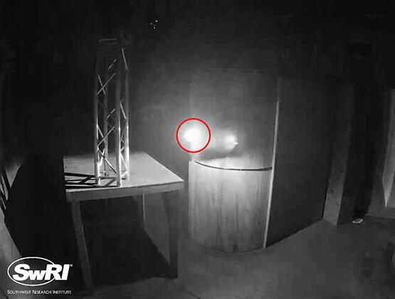 UAS autonomously avoiding an obstacle during a test flight in a dark, GPS-denied environment. The UAS is circled in red.