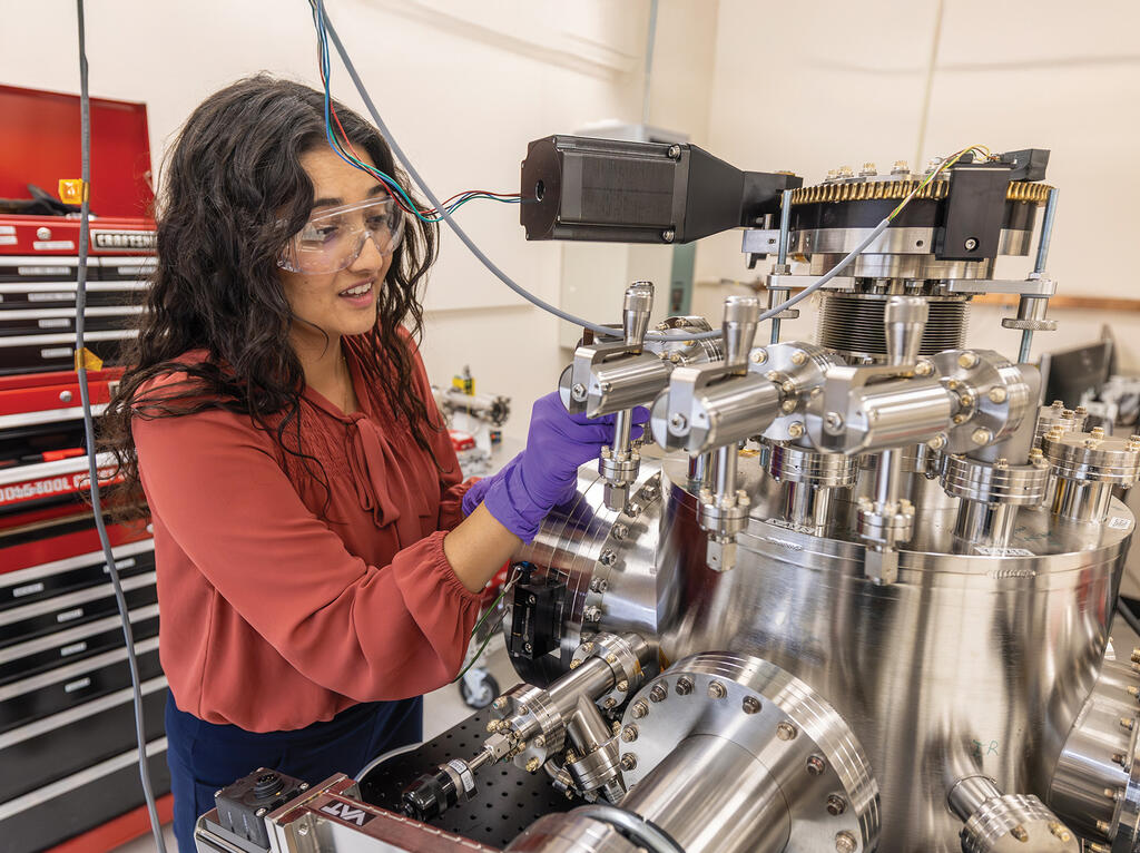 Dr. Danna Qasim working in SwRI's new Nebular Origins of the Universe Research Laboratory
