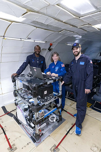 Pictured are Dr. Eugene Hoffman (left), Dr. Bonnie Dunbar (center), and Dr. Akbar Whizin (right)