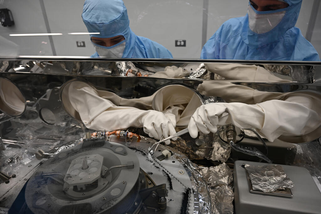 The untouched sample of rocks and dust from the surface of the asteroid was transported to a clean room for processing.