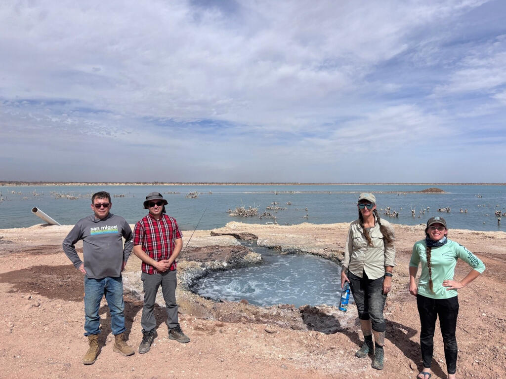 SwRI hydrologists and collaborators in front of Boehmer Lake in west Texas preparing to conduct research.