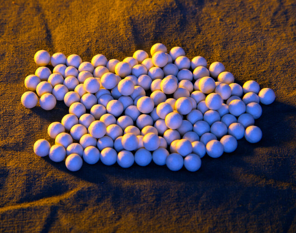 "Solar salt." These salt pellets relate to heat energy storage in solar mirrors.
