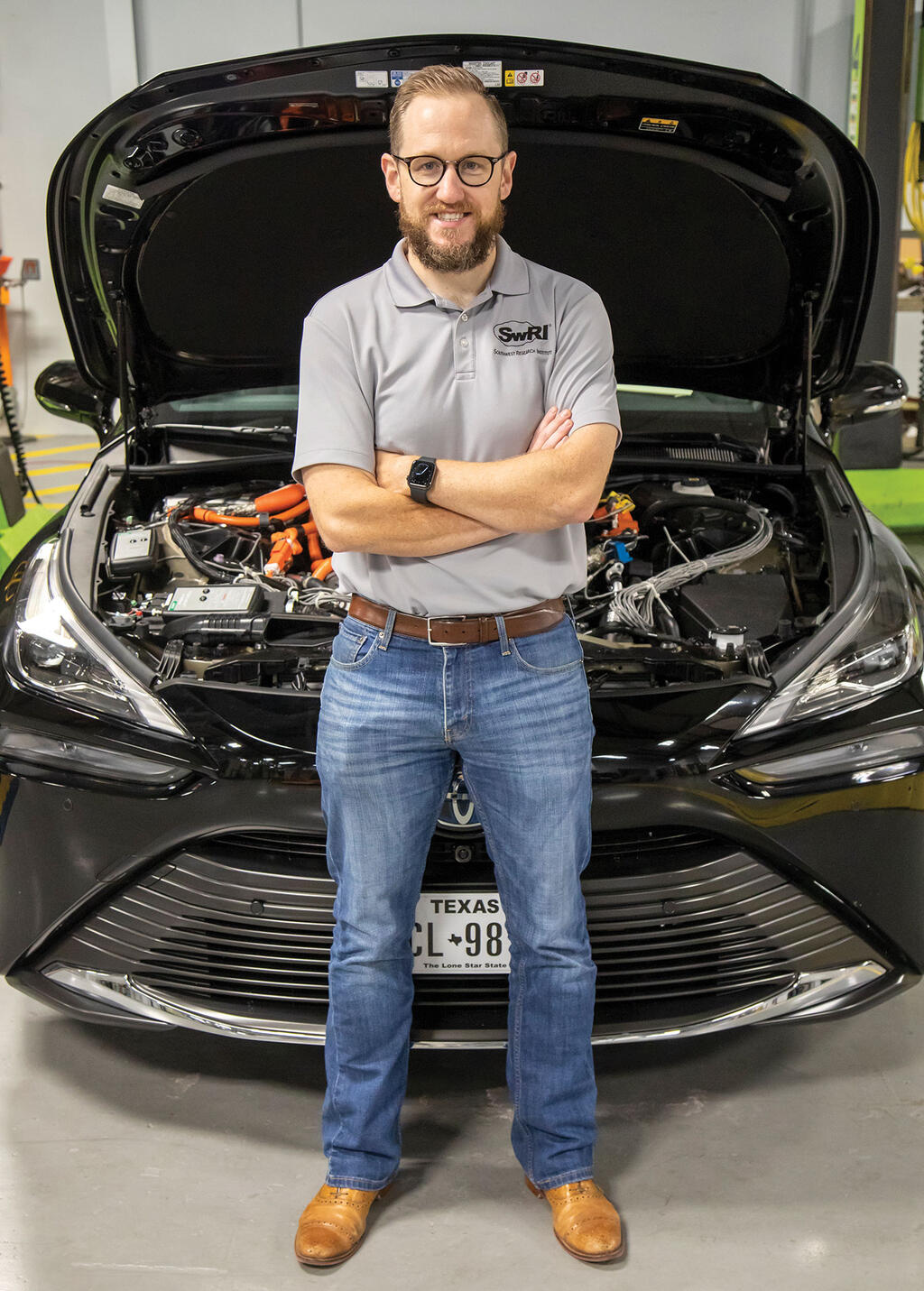 Portrait of Dr. Graham Conway in front of a vehicle