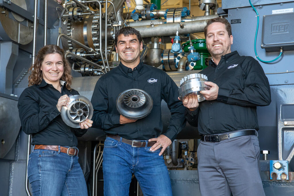  SwRI engineer and Senior Manager Dr. Jason Wilkes (center)