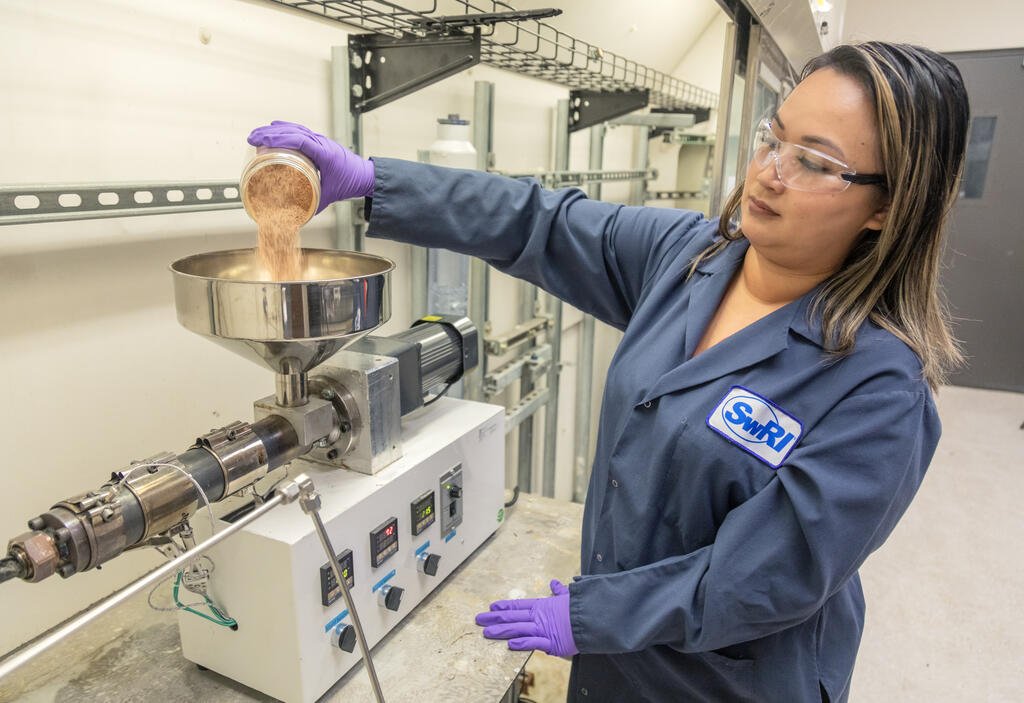 Female researcher using carbon capture technology at SwRI