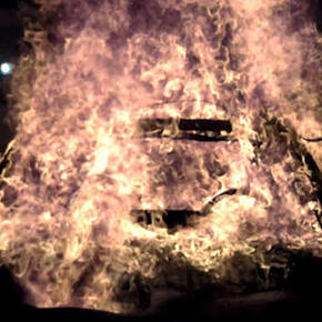 Car burning in EV containment at SwRI