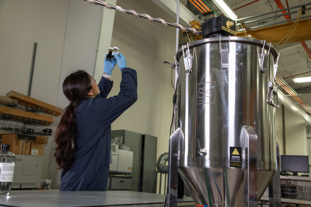 SwRI staff working with EZ Flow machinery