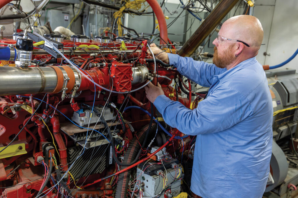 SwRI staff working on heavy-duty natural gas-fueled engine 