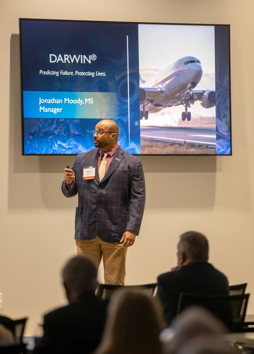 Jonathan Moody speaking in front of an audience