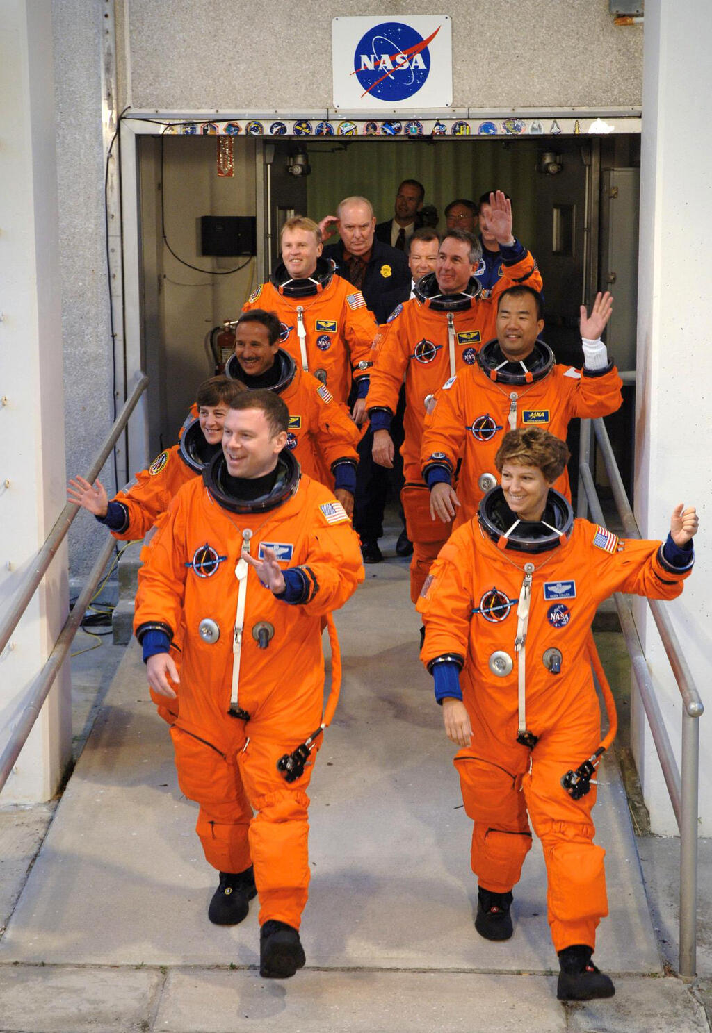 Col. Eileen Collins, commander, front right, leads the crew of the Discovery Return to Flight mission as they head to a Kennedy Space Center launch pad in July 2005. 