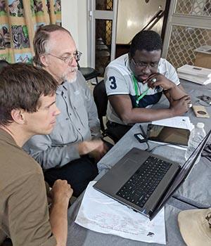 Dr. Marc Buie (center), flanked by an international team, gets his first look at the stellar occultation of Ultima Thule