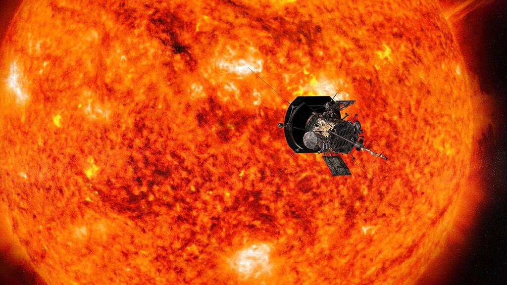NASA's Parker Solar Probe spacecraft in front of the orange Sun