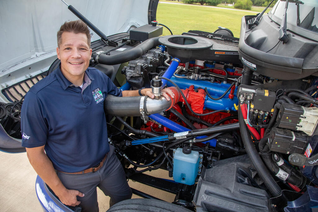 Ryan Williams with a truck engine