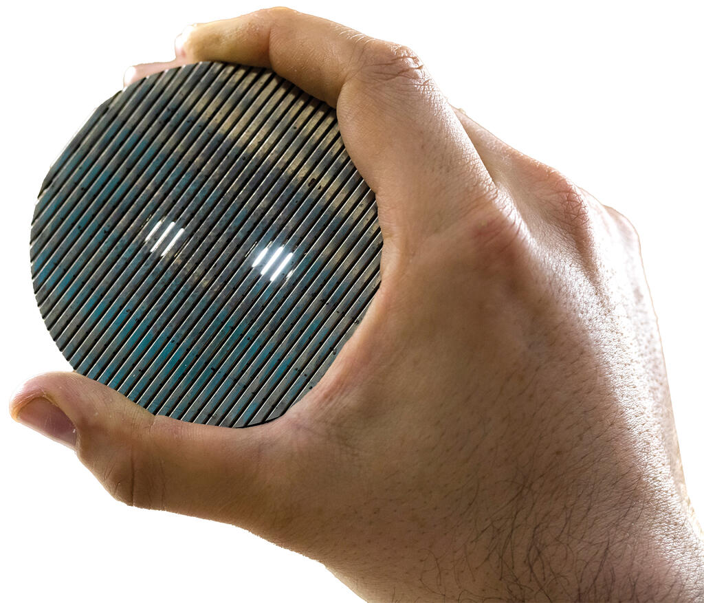 Caucasian hand holding sand control screen 