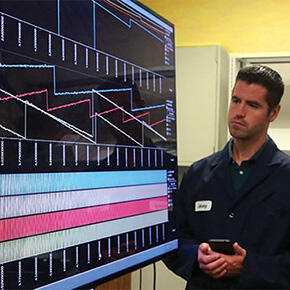 Team member analyzes visual data on a screen