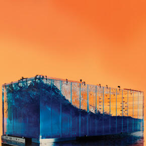 A clear slosh tank with blue fuel inside that is being sloshed from side to side