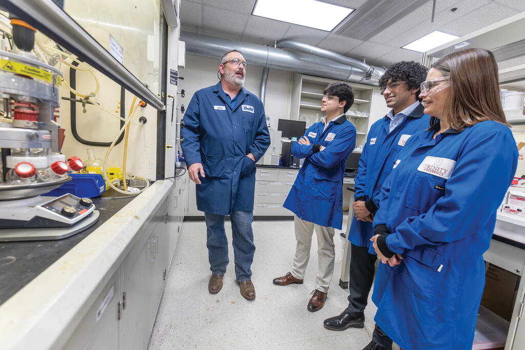 SwRI-Trinity Collaborative Team in lab - team includes (from left) SwRI Senior Research Scientist Christopher Dorsey, Trinity students Cesar Perozo and Hrithik Patel, and Trinity University Associate Professor Christina Cooley