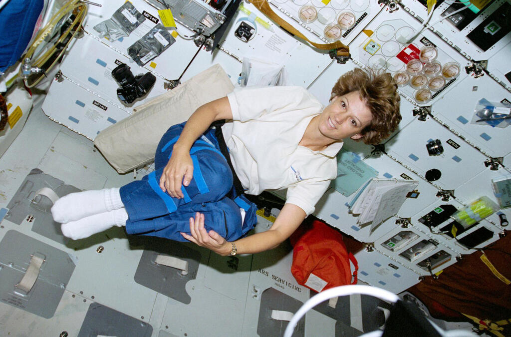 Astronaut Eileen M. Collins, mission commander, floats on Columbia's middeck during a free moment. 