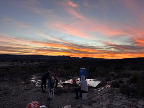 The SwRI hydrology group and collaborators at sunset are preparing to sample a well in west Texas