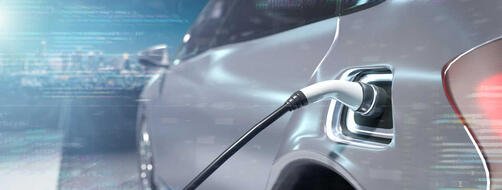 Power supply connect to a silver electric vehicle to charge the battery - 3d rendering