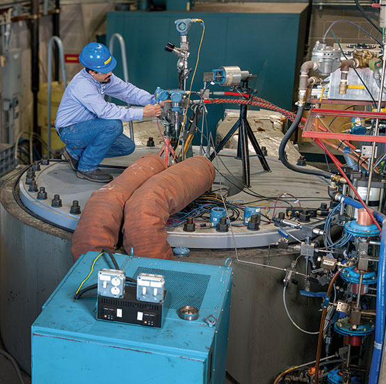 A man working in a nitrogen blowdown facility. 