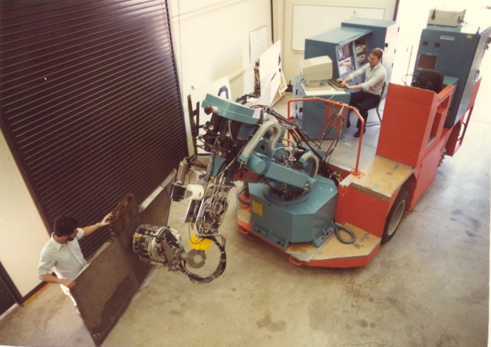 Tug being used as a mobile base for a heavy robot