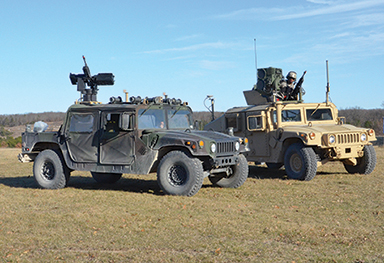 Paired robotic- and soldier-operated vehicles